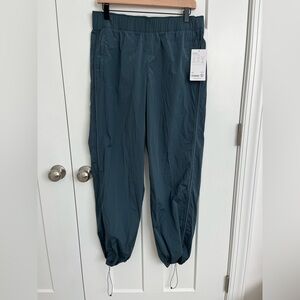 Athleta Rise Pant Womens M Blue Water Repellent Travel Hiking Jogger NWT Outdoor